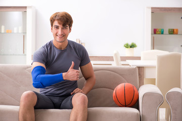 Injured man recovering at home from sports injury