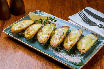 Baked mussels on a plate