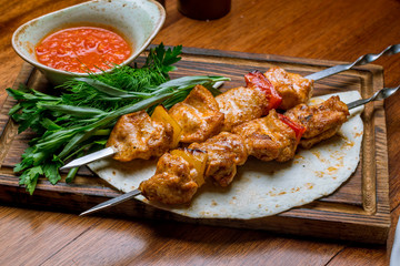 chicken kebab on board