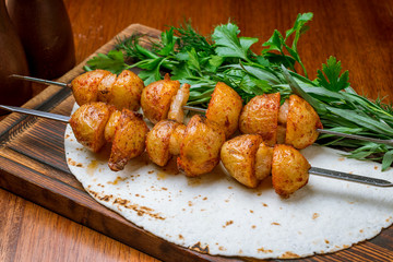 potatoes with fat tail on the grill