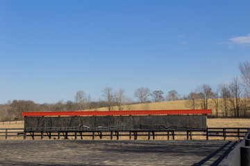 Horse riding ring with long bank of mirrors, horizontal aspect