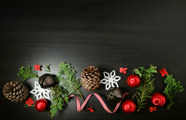 Christmas frame background. Christmas header with ornaments on dark wood.