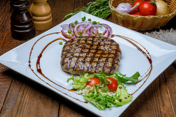 beef steak on a white plate