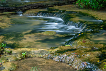 Fototapeta premium Beautiful small waterfall in the deep forest in Thailand.