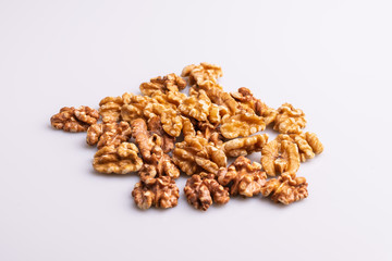 Walnut kernels pile isolated on white background