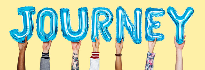 Hands showing journey balloons word