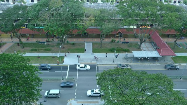 Bird's Eye View Of Continuous Moving Traffic And People Walking On Walkways And Crosswalk, Time Lapse