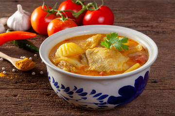 Chicken curry on wooden background