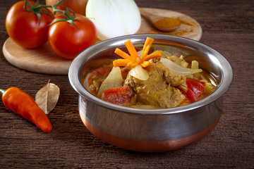 Chicken curry on wooden background