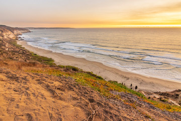 Maitencillo Beach close to Santiago de Chile and one of the most famous beach resorts in Chile mainland during sunset with the first twilight hours making it an amazing colorful landscape. Chile
