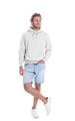Fototapeta premium Full length portrait of man in hoodie sweater on white background. Space for design