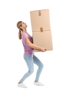 Full length portrait of woman carrying carton boxes on white background. Posture concept