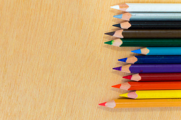Obraz premium Aligned colored pencils on right close up