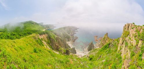 Obraz premium Mist over the sharp sea rocks