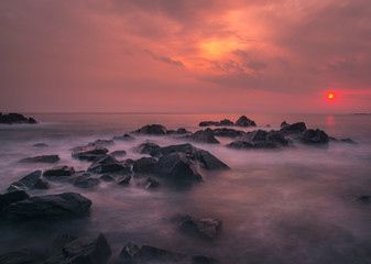 Fototapeta na wymiar Long exposure: rocks and stones on the seashore