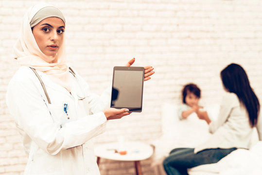 Portrait Of Arabic Female Doctor Holding Ipad