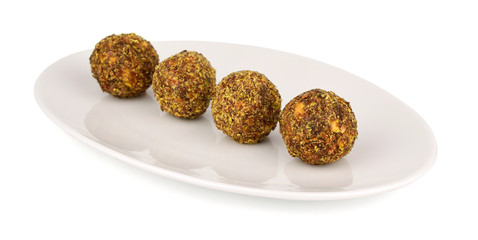 Homemade Candy with Fruits, Nuts and Honey on a Platter. Rich in Proteins, Fiber and Carbs Healthy Snack. Isolated on White.