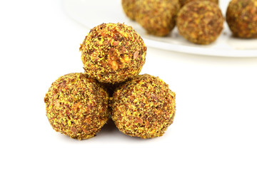 Homemade Candy with Fruits, Nuts and Honey. Rich in Proteins, Fiber and Carbs Healthy Snack. Isolated on White.