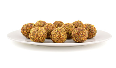 Homemade Candy with Fruits, Nuts and Honey on a Platter. Rich in Proteins, Fiber and Carbs Healthy Snack. Isolated on White.