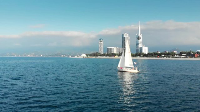 White Yacht in the sea in Batumi summer Georgia 4K Drone
