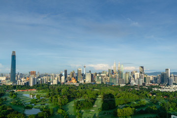 Fototapeta premium Morning view over Kuala Lumpur, capital of Malaysia. Its modern skyline is dominated by the 451m tall KLCC, a pair of glass and steel clad skyscrapers.