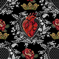 Embroidery trend floral seamless pattern with red rose, heart, lace and crown. Vector traditional folk flowers decor on black background for clothing design. - 232900716