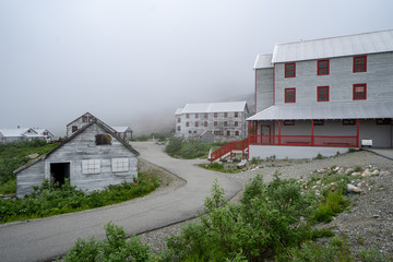 Fototapeta na wymiar Extremely foggy view of Independence Mine in Palmer Alaska along Hatcher Pass. Considered a ghost town