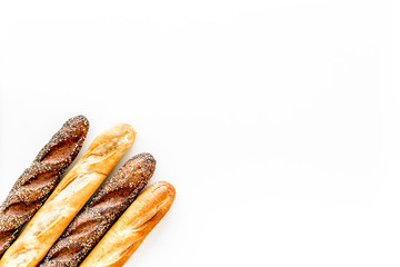 Baguettes. White and brown on white background top view