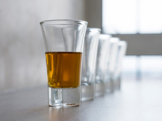 Set of empty wine, brandy, liqueur, tincture, cognac, whiskey glasses. Copy space for text