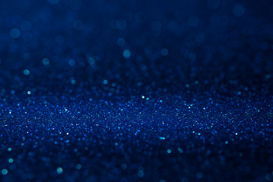 Abstract dark vivid navy blue sparkling glitter wall and floor perspective background studio with blur bokeh.luxury holiday backdrop mock up for display of product.holiday festive greeting card.