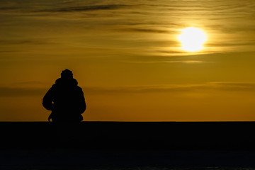 Fototapeta na wymiar silhouette of a man in the sunset