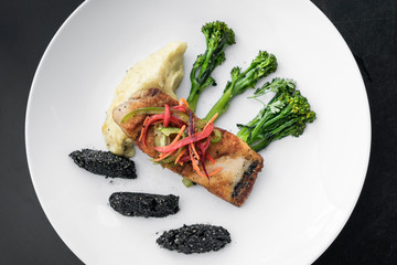 red snapper fish fillet with vegetables and black sesame rice