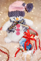 Snowman with gifts. Christmas background
