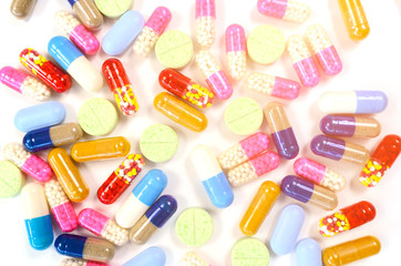 Medicine in light protected bottle. Capsules in orange bottle. Refill prescription concept.