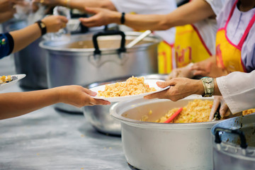 The hands of the rich give food to the hands of the poor. Concept: The concept of sharing