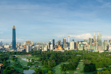 Fototapeta premium KUALA LUMPUR, MALAYSIA - 11th NOV 2018; Morning view over Kuala Lumpur, capital of Malaysia. Its modern skyline is dominated by the 451m tall KLCC, a pair of glass and steel clad skyscrapers.