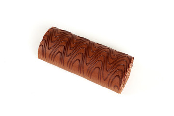 Chocolate biscuit roll cake isolated on white background.