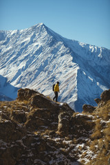 Figure of a walking tourist against the background of the mountains. The Republic of Ingushetia.