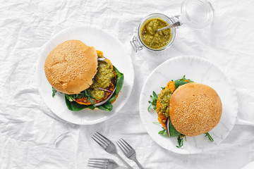 Vegetarian burger pumpkin cutlet spinach arugula pesto top view Healthy food