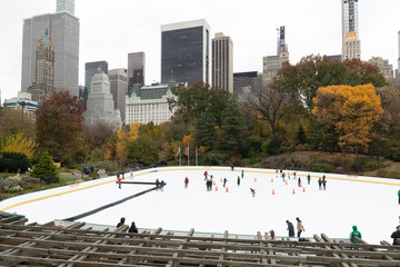 Central Park ice skate rink in New York City autumn foliage
