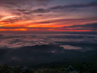 Beautiful Sunrise Sky with Sea of the mist of fog and heart shaped lake  in the morning on Khao Luang mountain in Ramkhamhaeng National Park,Sukhothai province Thailand