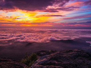 Beautiful Sunrise Sky with Sea of the mist of fog in the morning on Khao Luang mountain in Ramkhamhaeng National Park,Sukhothai province Thailand