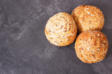 Fresh baked crunchy rolls or bread for breakfast, place for text