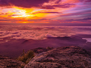 Fototapeta na wymiar Beautiful Sunrise Sky with Sea of the mist of fog in the morning on Khao Luang mountain in Ramkhamhaeng National Park,Sukhothai province Thailand