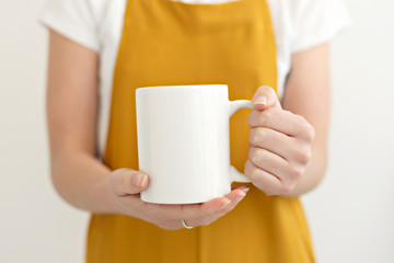 woman holding a cup of coffee