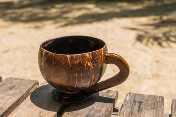 Coffee in a coconut shell for a bright morning of the islanders.