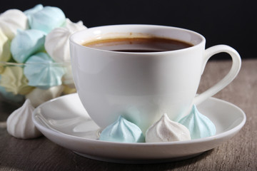 A cup of coffee and meringues for breakfast	