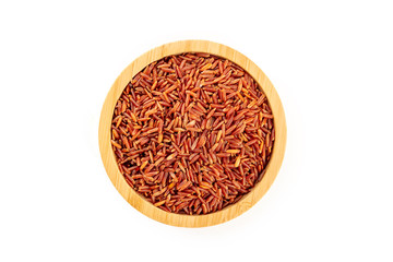 Fototapeta na wymiar Red rice, shot from the top in a wooden bowl on a white background with a place for text