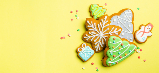 Christmas cookies on bright yellow background