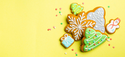 Fototapeta premium Christmas cookies on bright yellow background